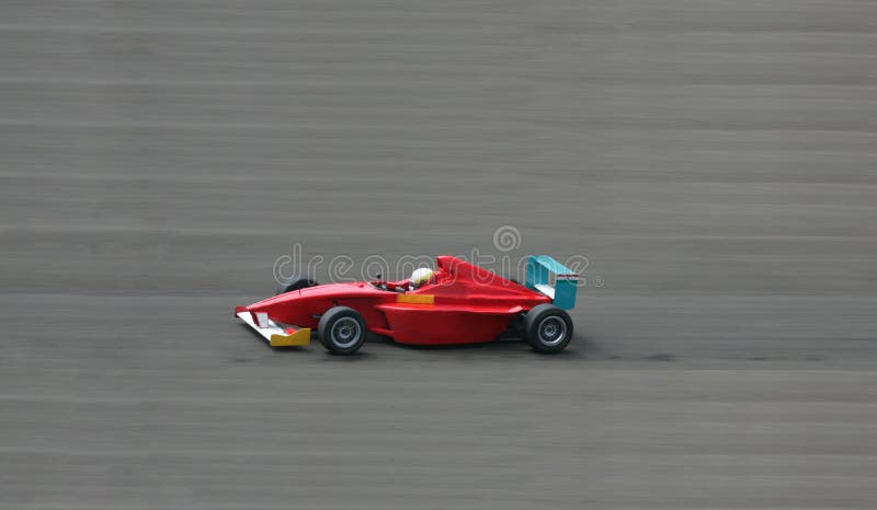 Rotes laufendes Auto lizenzfreie stockbilder Rotes laufendes Auto lizenzfreie stockbilder