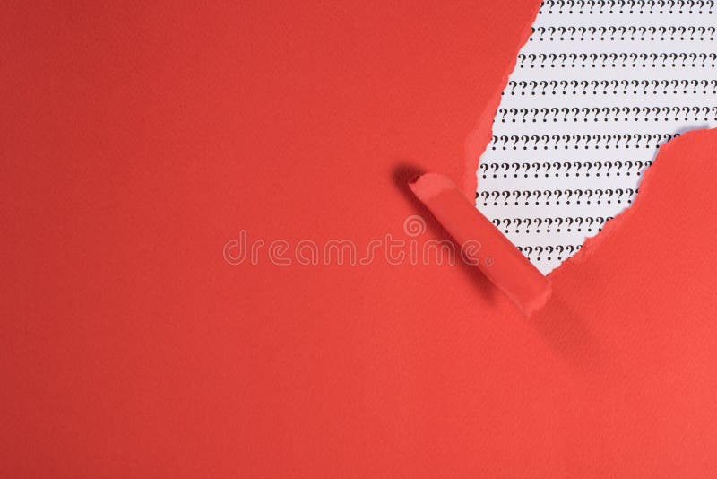 Red paper teared revealing question mark on white paper. concept of FAQ, Q&A, search, riddle and information. Red paper teared revealing question mark on white paper. concept of FAQ, Q&A, search, riddle and information