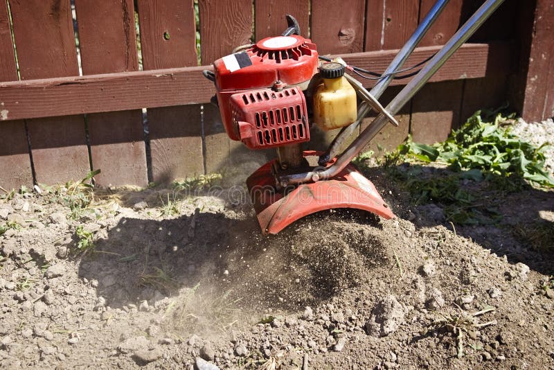 Garden Tiller Turning Over Dirt Stock Photo Image Of Machine