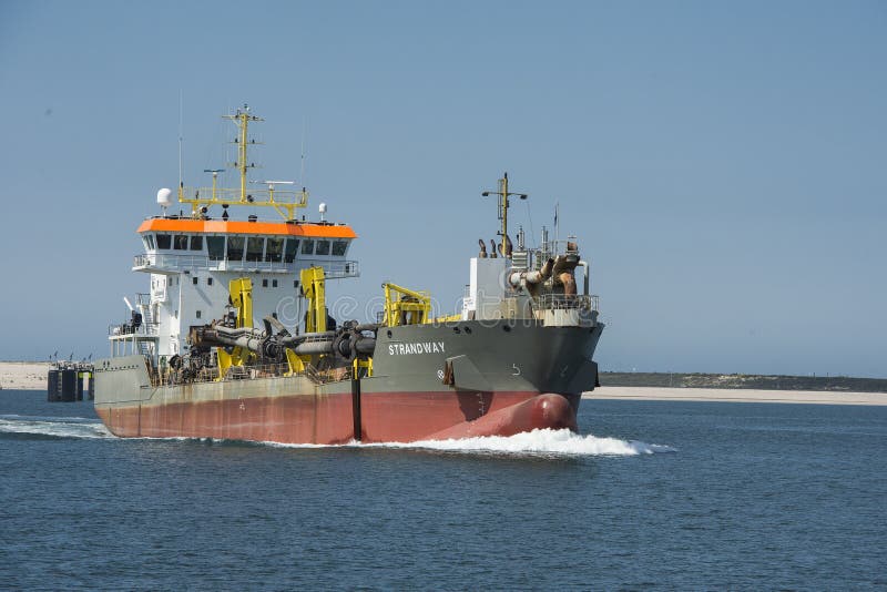Trailing suction hopper dredger Strandway in the harbour of Rotterdam stock images Trailing suction hopper dredger Strandway in the harbour of Rotterdam stock images
