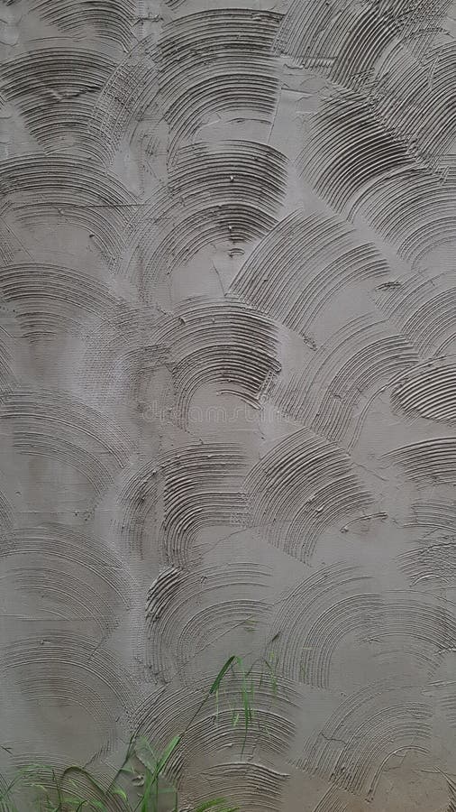 Rough cement wall plastering with circle geometric scratched pattern stock photography