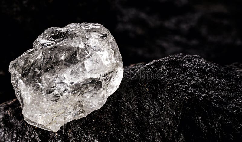 rough diamond, crystal in an allotropic form of carbon, uncut gemstone,  concept of luxury or wealth Stock Photo