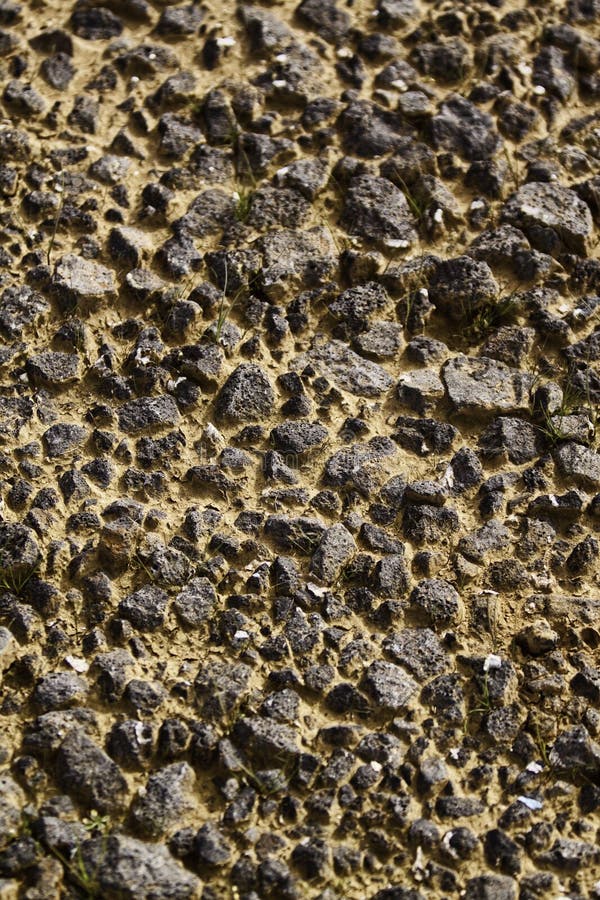 Rough dry ground covered with rocks and mud or earth in between. Rough dry ground covered with rocks and mud or earth in between.