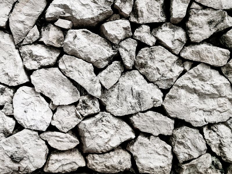 Rough Rock Stone Texture in the Wall for Background and Wallpaper Stock
