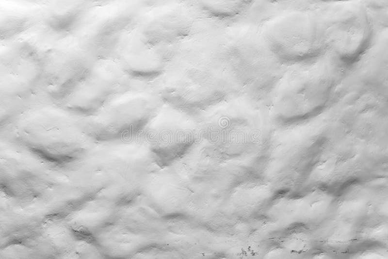 Rough uneven white painted stone wall texture stock image