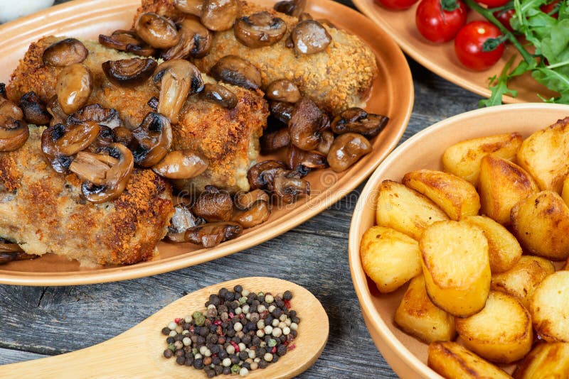 Roulade of pork with roasted mushrooms and potatoes royalty free stock image Roulade of pork with roasted mushrooms and potatoes royalty free stock image