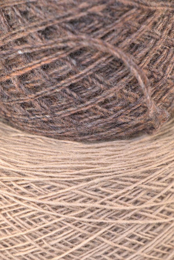 Close up photo of 2 rolled wool knitting yarn on top of each other vertically.Arts and craft,Background texture. Close up photo of 2 rolled wool knitting yarn on top of each other vertically.Arts and craft,Background texture