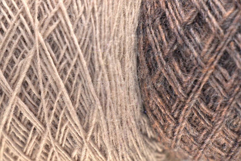 Close up photo of 2 rolled wool knitting yarn on top of each other vertically.Arts and craft,Background texture. Close up photo of 2 rolled wool knitting yarn on top of each other vertically.Arts and craft,Background texture