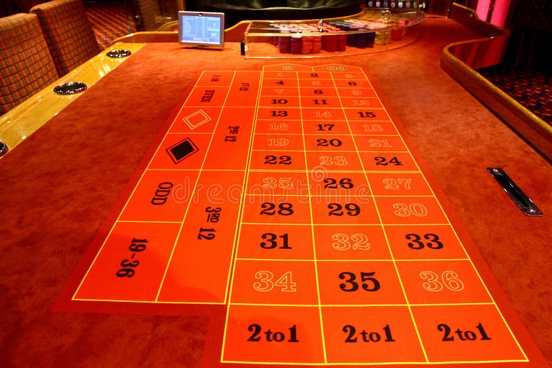 Roulette table in a casino stock image. Image of area 53429047