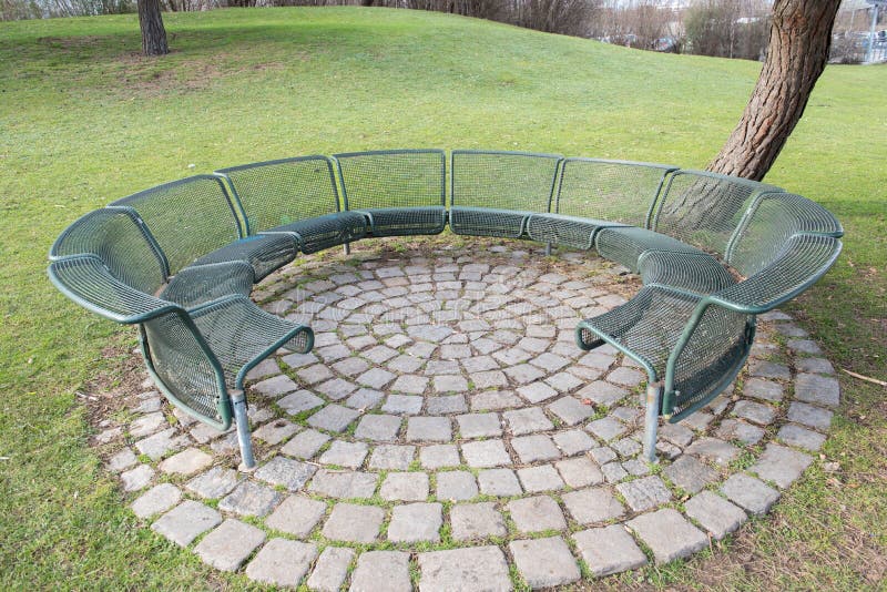 Round bench of metal open fort resting, discussing and sitting stock photo