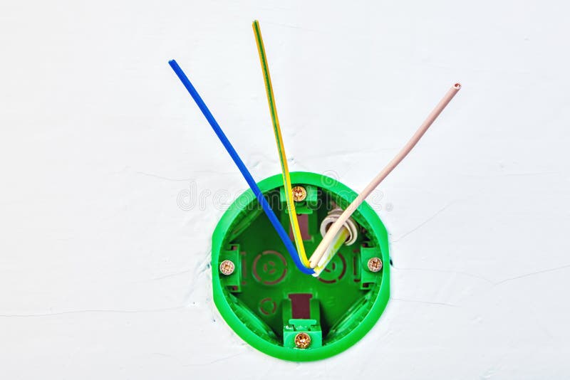 Plastic Corrugated Pipes with Electric Cable Inside Sticking Out of Wall for Power Sockets Stock