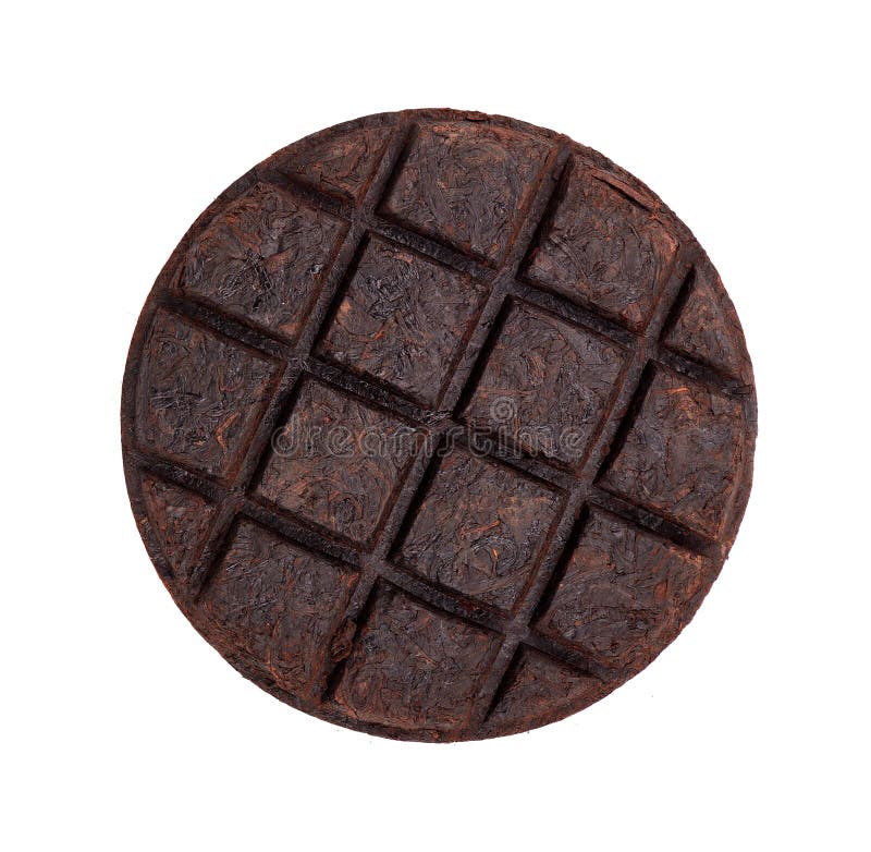 Round flat disc of puer tea isolated on white background. Chinese tea Shou Puer. Pressed fermented Pu-erh tea. Macro royalty free stock images Round flat disc of puer tea isolated on white background. Chinese tea Shou Puer. Pressed fermented Pu-erh tea. Macro royalty free stock images