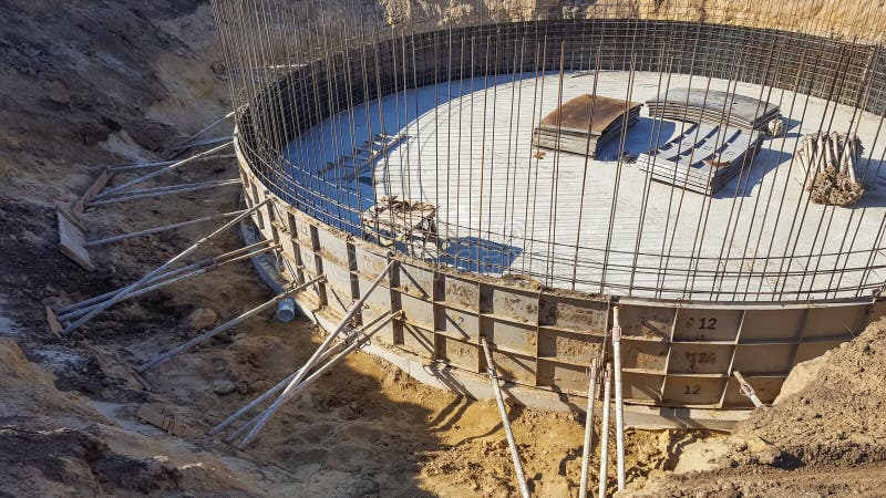 Round the foundation with the rebar in the early construction. stock photo Round the foundation with the rebar in the early construction. stock photo