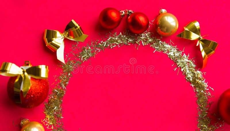 Round golden tinsel frame on red background. stock photos Round golden tinsel frame on red background. stock photos