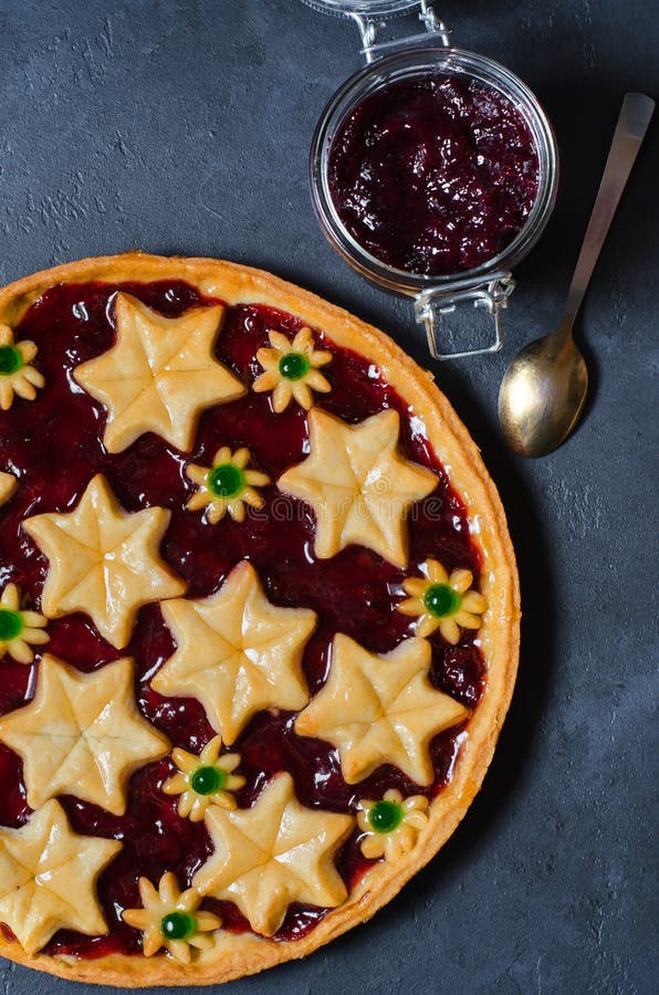 Round homemade cake with plum jam. Dark background. Vertical photo. Flat Lay stock photography Round homemade cake with plum jam. Dark background. Vertical photo. Flat Lay stock photography