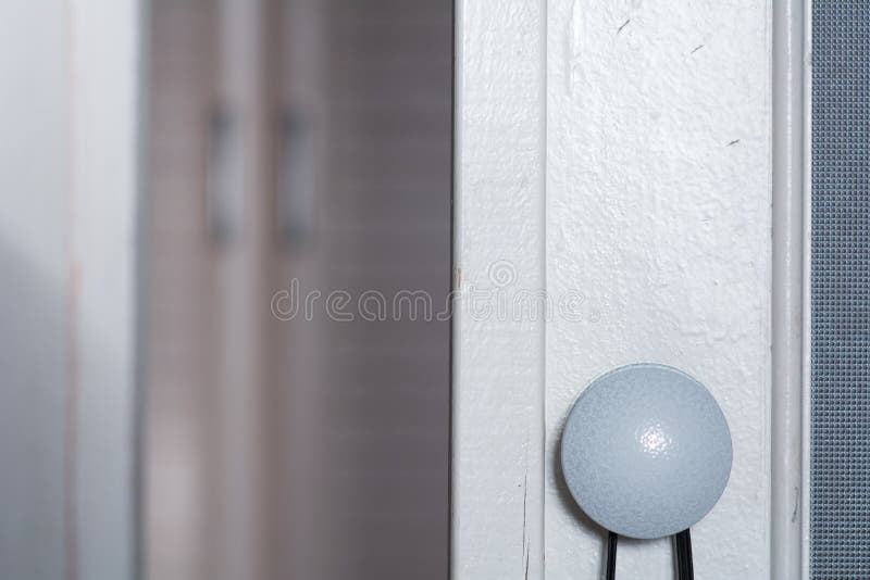 Round Light Pen on an Old Door and a Blurry Wall Stock Photo Image of