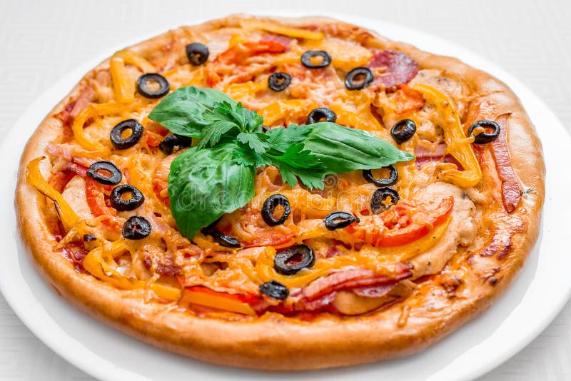 Round Pizza with Meat, Tomatoes and Herbs, Cutlery and Spices, on a ...