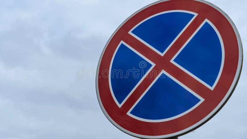 Round Road Sign with a Red Cross on a Blue Background. a Sign ...