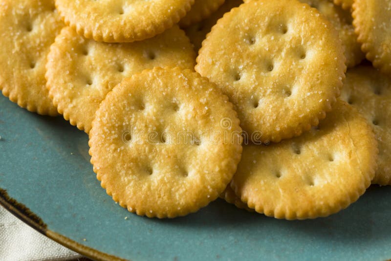 Yellow crackers on plate stock image. Image of pastry 12527975