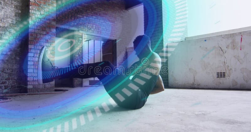 Round scanner against african american working out with medicine ball in the gym stock photography