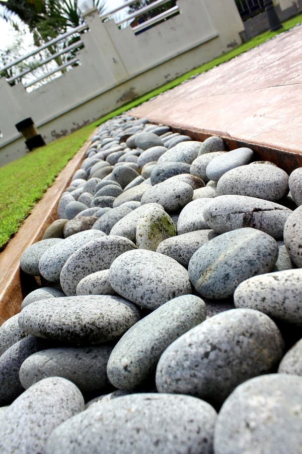 Round stone and grass