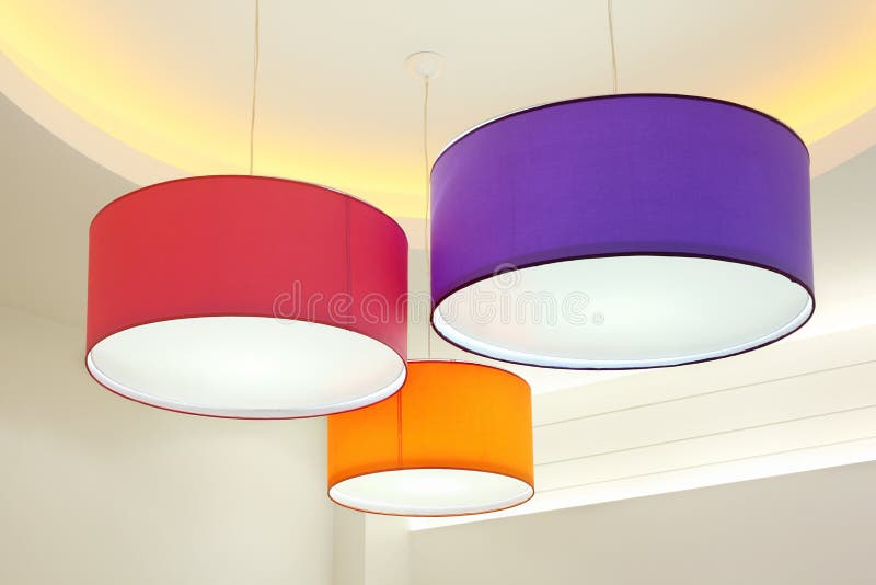 Round stylish lampshades hang from ceiling royalty free stock image