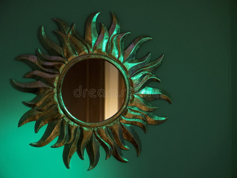 Round Sun Shaped Mirror on a Blue Wall Stock Photo Image of color
