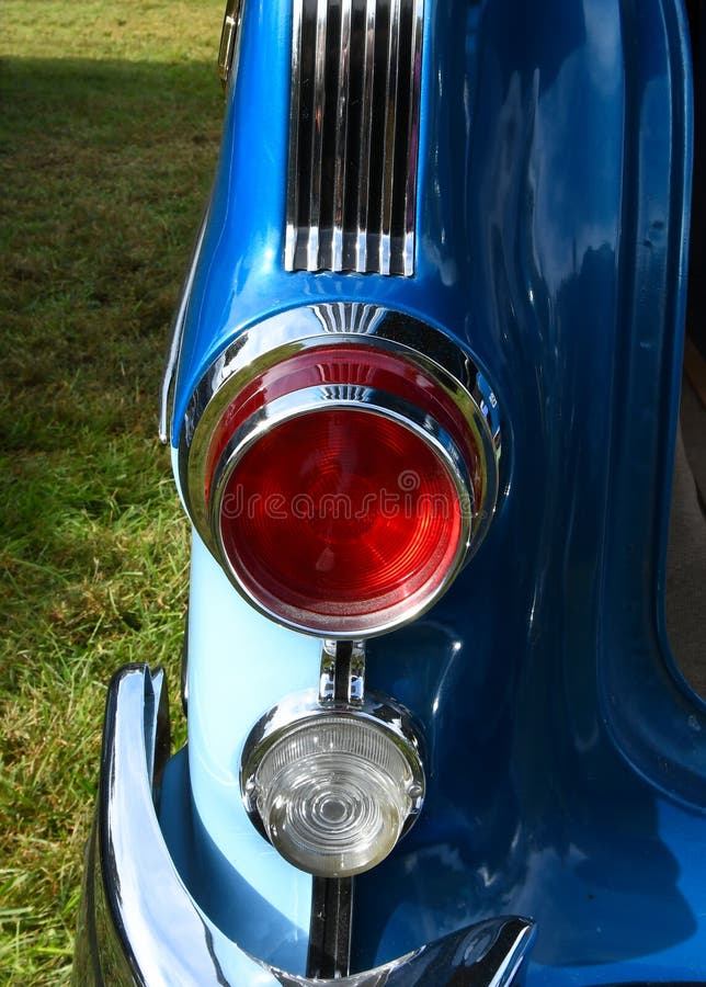 A Red Round Tail Light on a Blue Car Stock Photo Image of retro