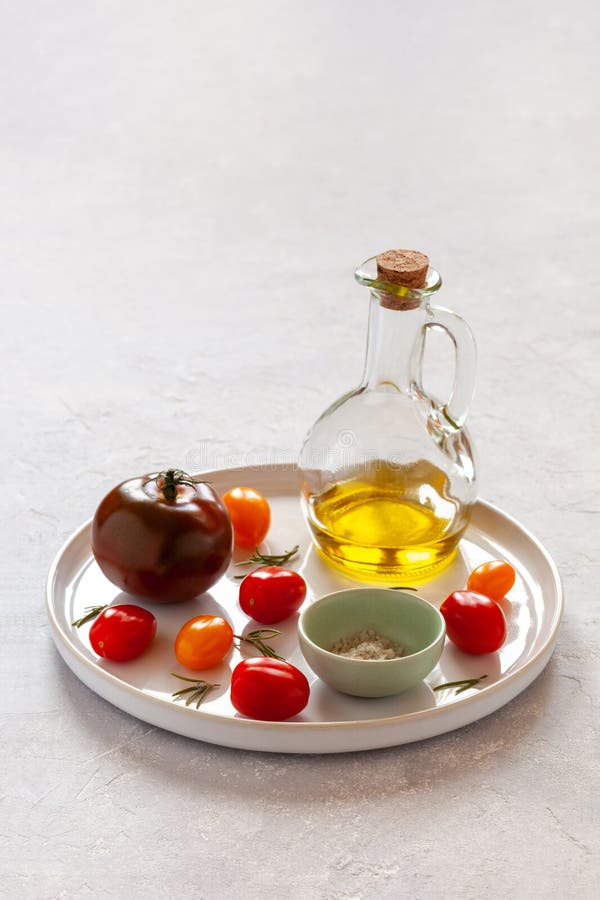 Round Tray with Different Tomato Varieties, Salt and Olive Oil Stock