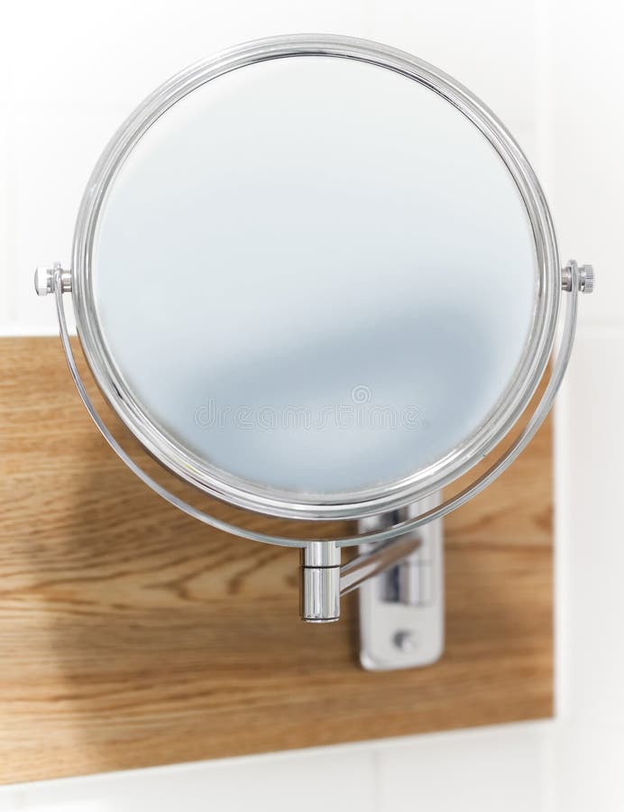 Round wall mirror for the bath. Close-up photo with selective focus. Bathtub stand stock images, royalty-free photos and pictures