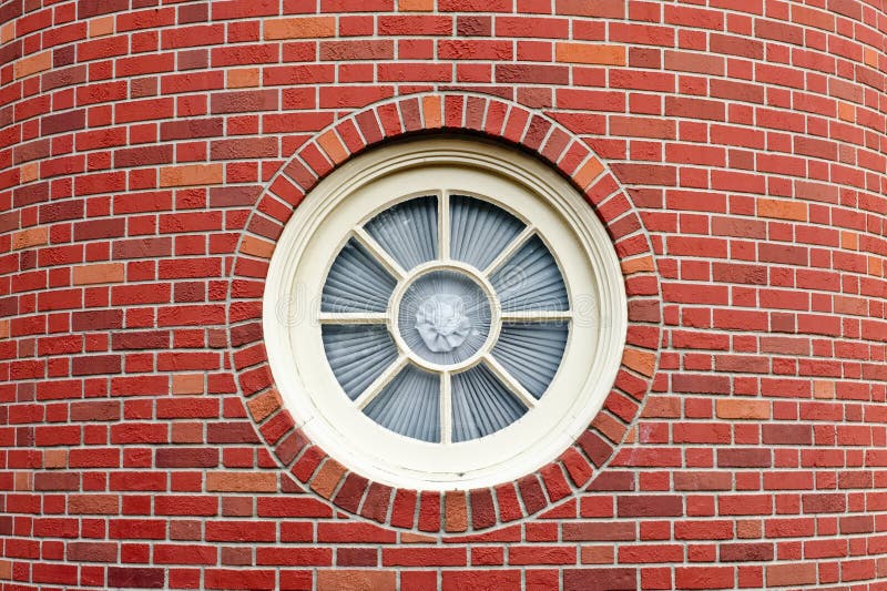 Round window in brick tower