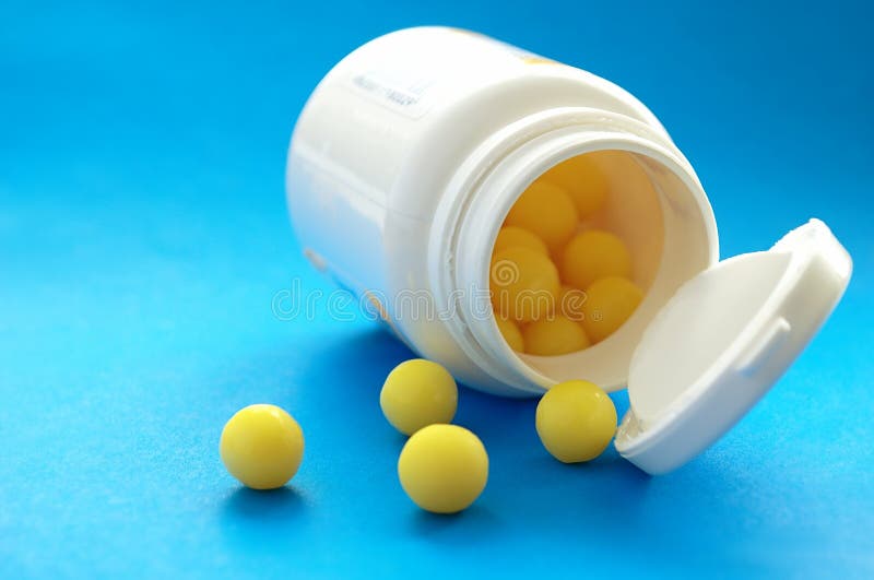 Round yellow pill stock image. Image of pharmaceutical 23414889
