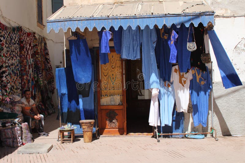 Souvenirs on display in Essaouira, Morocco: typical blue and white dresses. Souvenirs on display in Essaouira, Morocco: typical blue and white dresses