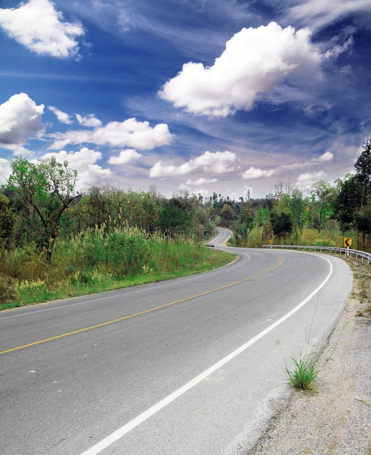 Empty curve road and blue sky. Empty curve road and blue sky