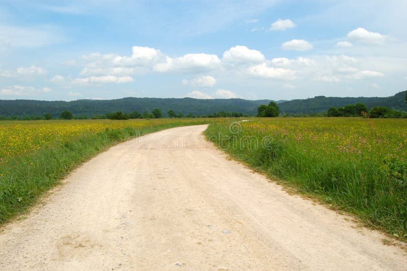 Dusty track meandering across a plain. Dusty track meandering across a plain