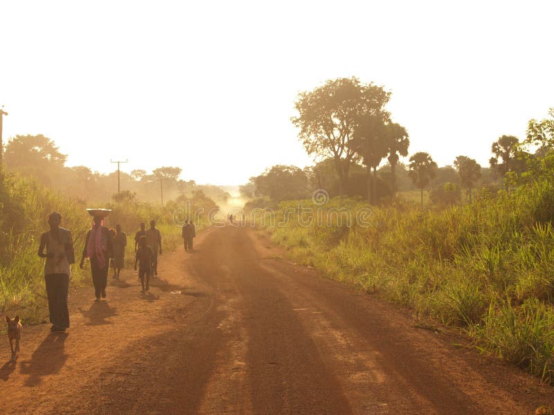 Africa ghana west forest dust dusty road farmers poor poverty dusk golden hour path. Africa ghana west forest dust dusty road farmers poor poverty dusk golden hour path