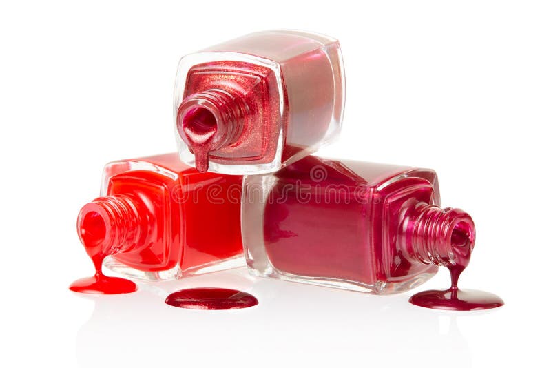 Rovesciamento rosso delle bottiglie dello smalto fotografia stock libera da diritti Rovesciamento rosso delle bottiglie dello smalto fotografia stock libera da diritti