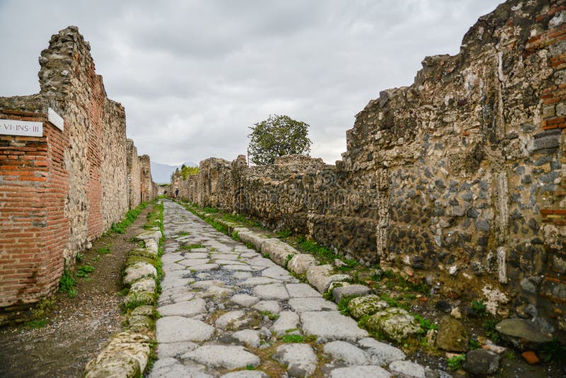 Ruins of ancient city of Pompeii, destroyed by volcano Mount Vesuvius, two millenniums ago, 79 AD. open for visitors, a popular destination for tourists in Italy. Ruins of ancient city of Pompeii, destroyed by volcano Mount Vesuvius, two millenniums ago, 79 AD. open for visitors, a popular destination for tourists in Italy