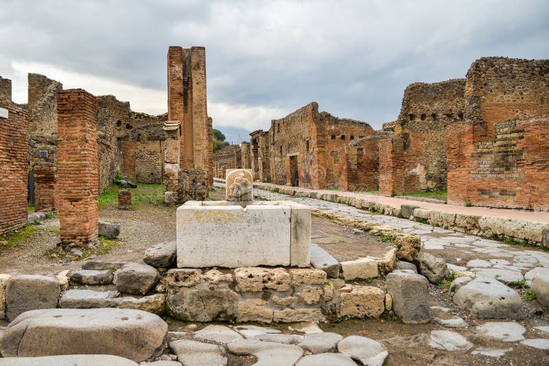 Ruins of ancient city of Pompeii, destroyed by volcano Mount Vesuvius, two millenniums ago, 79 AD. open for visitors, a popular destination for tourists in Italy. Ruins of ancient city of Pompeii, destroyed by volcano Mount Vesuvius, two millenniums ago, 79 AD. open for visitors, a popular destination for tourists in Italy