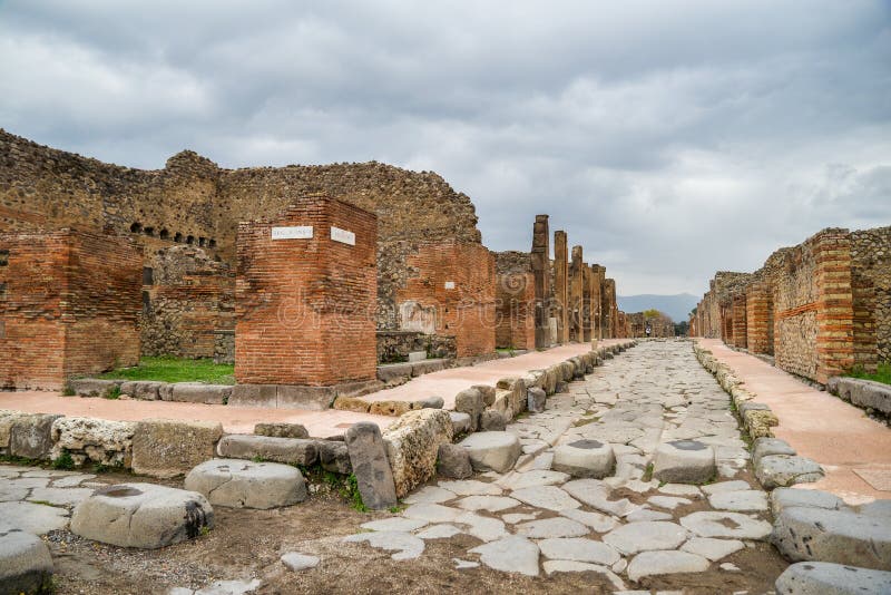 Ruins of ancient city of Pompeii, destroyed by volcano Mount Vesuvius, two millenniums ago, 79 AD. open for visitors, a popular destination for tourists in Italy. Ruins of ancient city of Pompeii, destroyed by volcano Mount Vesuvius, two millenniums ago, 79 AD. open for visitors, a popular destination for tourists in Italy