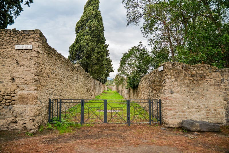 Ruins of ancient city of Pompeii, destroyed by volcano Mount Vesuvius, two millenniums ago, 79 AD. open for visitors, a popular destination for tourists in Italy. Ruins of ancient city of Pompeii, destroyed by volcano Mount Vesuvius, two millenniums ago, 79 AD. open for visitors, a popular destination for tourists in Italy