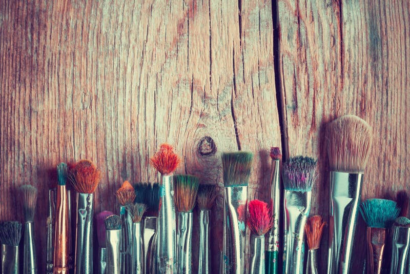 Row of artist paintbrushes closeup on old wooden table, retro st royalty free stock photos Row of artist paintbrushes closeup on old wooden table, retro st royalty free stock photos