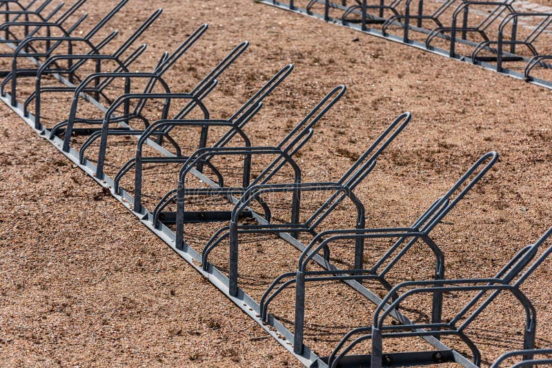 Row of Bicycle Racks on Gravel Ground.. Stock Image Image of park