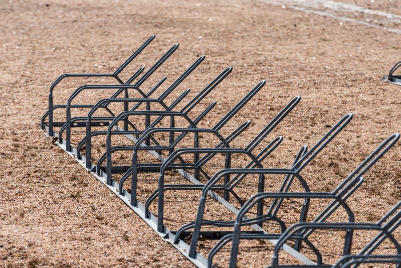 Row of Bicycle Racks on Gravel Ground.. Stock Image Image of chain