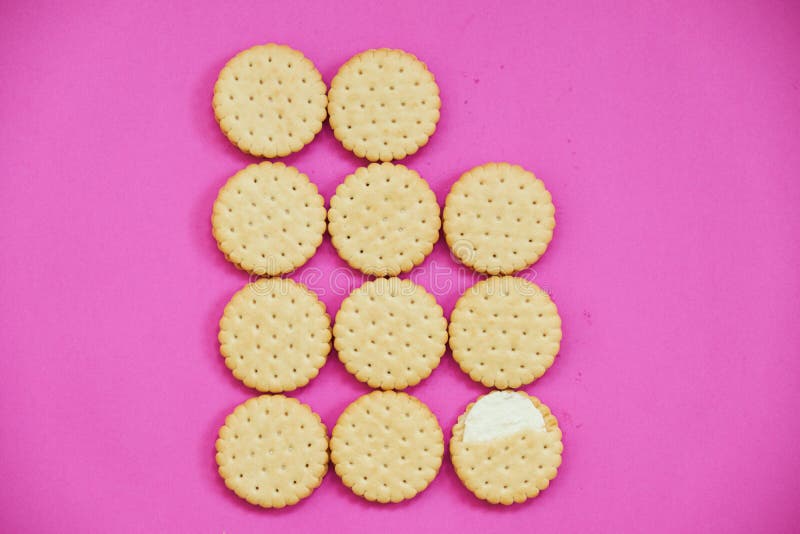 A row of brown cookies. Close up.