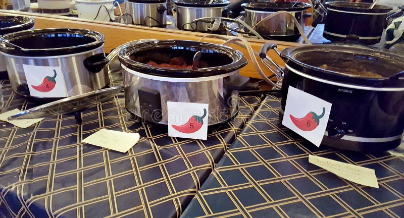 Row of crock pots in chili cook-off contest