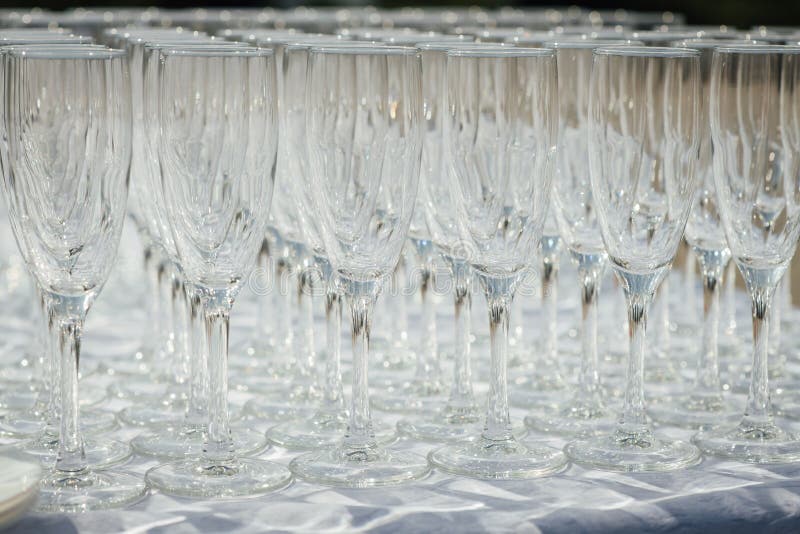 A Row of Empty Champagne Glasses on Table. Banquet Setting Stock Photo