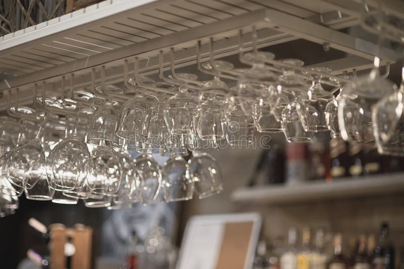 A Row of Empty Glasses Hang Over the Bar Counter Stock Image Image of