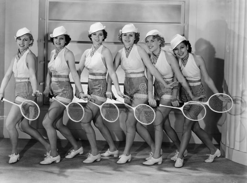 Row of female tennis players in matching outfits