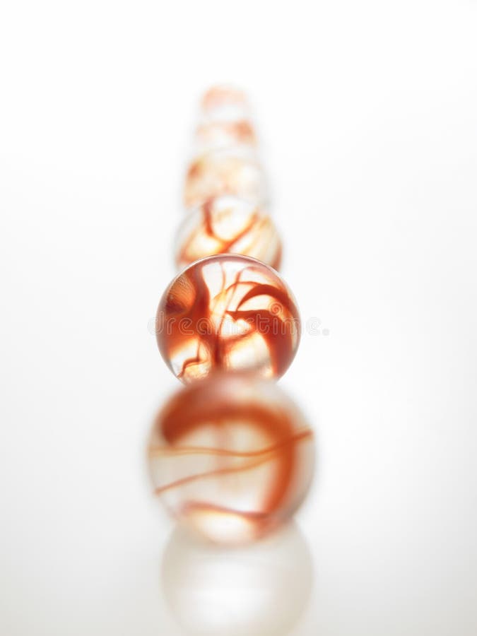 A row of glass Red marbles stock image. Image of background 22465487